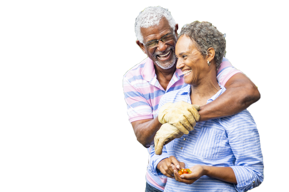 Senior African American couple gardening