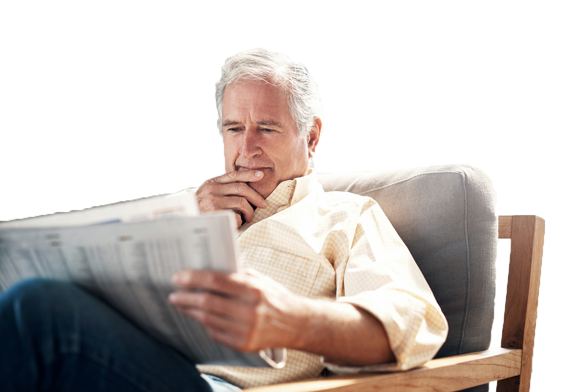 Senior man reading newspaper